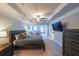Spacious main bedroom with tray ceiling, ceiling fan, and sitting area at 991 Sibley Ne Ln, Atlanta, GA 30324