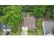 Aerial view of a home with a large lot, lush landscaping, a pool, and a separate guest house at 115 Ocee View Ct, Alpharetta, GA 30022