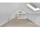 Finished attic loft area with hardwood floors, dormer windows and extra storage at 115 Ocee View Ct, Alpharetta, GA 30022