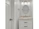 Charming bathroom featuring a vanity with a marble countertop, modern lighting and traditional details at 115 Ocee View Ct, Alpharetta, GA 30022