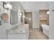 Elegant bathroom featuring double vanity, oval mirrors, modern lighting, and glass-enclosed shower at 115 Ocee View Ct, Alpharetta, GA 30022