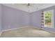 Cozy bedroom with natural lighting, plush carpet and neutral tone at 115 Ocee View Ct, Alpharetta, GA 30022