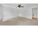 Bright bedroom with plush carpeting, modern fan, and fresh, neutral paint at 115 Ocee View Ct, Alpharetta, GA 30022