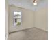 Neutral bedroom featuring carpet, natural light, and ceiling fan at 115 Ocee View Ct, Alpharetta, GA 30022