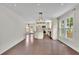 Bright kitchen featuring hardwood floors, white cabinets, stainless steel appliances, and a center island at 115 Ocee View Ct, Alpharetta, GA 30022