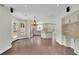 Open-concept kitchen boasts custom cabinets, stainless appliances, island, breakfast bar, and backyard access at 115 Ocee View Ct, Alpharetta, GA 30022