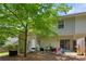 Cozy backyard patio with a grill, outdoor seating, and a play area with a slide for entertaining guests at 3313 Thornbridge Dr, Powder Springs, GA 30127