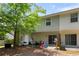 Cozy backyard patio with a grill, outdoor seating, and a play area with a slide for entertaining guests at 3313 Thornbridge Dr, Powder Springs, GA 30127