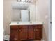 Bathroom vanity showcasing double sinks and ample storage beneath a large mirror at 3313 Thornbridge Dr, Powder Springs, GA 30127