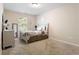 Neutral bedroom featuring a comfortable bed, dresser, and plenty of natural light at 3313 Thornbridge Dr, Powder Springs, GA 30127