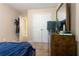 Bedroom showcasing a closet, dresser, and bed, offering functionality and comfort at 3313 Thornbridge Dr, Powder Springs, GA 30127