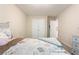 Bedroom featuring a bed, dresser, and large closet doors, offering great storage space at 3313 Thornbridge Dr, Powder Springs, GA 30127