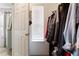 Walk-in closet, filled with clothing, and natural light at 3313 Thornbridge Dr, Powder Springs, GA 30127