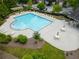 Community pool surrounded by trees and lounge chairs offering ample room for relaxation and fun in the sun at 3313 Thornbridge Dr, Powder Springs, GA 30127