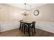 Dining room with modern chandelier and panel molding at 3313 Thornbridge Dr, Powder Springs, GA 30127
