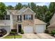 Charming townhome with a well-manicured lawn and an attached one car garage at 3313 Thornbridge Dr, Powder Springs, GA 30127