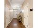 Inviting hallway with hardwood floors, neutral walls, and classic white trim at 3313 Thornbridge Dr, Powder Springs, GA 30127