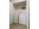 Bright laundry closet featuring a side-by-side washer and dryer for convenience at 3313 Thornbridge Dr, Powder Springs, GA 30127