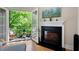 Balcony view featuring a fireplace and outdoor seating surrounded by lush greenery at 351 Washington Ne Ave # 205, Marietta, GA 30060