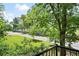 Enjoy the private balcony view of mature trees and a quiet street from this condo at 351 Washington Ne Ave # 205, Marietta, GA 30060