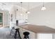 Modern wet bar with granite counters, stainless steel sink, pendant lighting, and black bar stools at 351 Washington Ne Ave # 205, Marietta, GA 30060