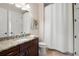 Bathroom features granite counters, dark cabinets, and a shower-tub with white shower curtain at 351 Washington Ne Ave # 205, Marietta, GA 30060