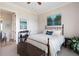 Bright bedroom with a large window, ceiling fan, neutral walls, and access to a bathroom at 351 Washington Ne Ave # 205, Marietta, GA 30060