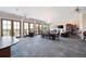Large common room with a chandelier, neutral carpet, and views through a wall of windows at 351 Washington Ne Ave # 205, Marietta, GA 30060