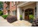 Elegant entrance featuring arched doorways and professional landscaping at 351 Washington Ne Ave # 205, Marietta, GA 30060