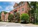 Charming brick condo building with balconies and tree-lined street at 351 Washington Ne Ave # 205, Marietta, GA 30060