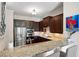 Modern kitchen features stainless steel appliances, granite countertops, and dark wood cabinetry at 351 Washington Ne Ave # 205, Marietta, GA 30060