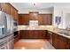 Modern kitchen featuring stainless appliances, dark wood cabinets and granite counters at 351 Washington Ne Ave # 205, Marietta, GA 30060