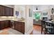 Modern kitchen with stainless steel appliances and granite countertops, open to living area at 351 Washington Ne Ave # 205, Marietta, GA 30060