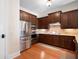 Gourmet kitchen with stainless steel appliances, granite countertops, and wood cabinets at 351 Washington Ne Ave # 205, Marietta, GA 30060