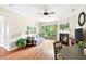 Spacious living room with a fireplace, ceiling fan and balcony at 351 Washington Ne Ave # 205, Marietta, GA 30060