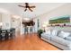 Spacious living area with hardwood flooring and a view of the kitchen provides an open, airy feel at 351 Washington Ne Ave # 205, Marietta, GA 30060