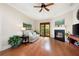 Living room features a fireplace, hardwood floors, and access to a balcony with lots of natural sunlight at 351 Washington Ne Ave # 205, Marietta, GA 30060