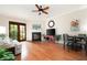 Bright living room with hardwood floors, fireplace, ceiling fan, and access to an outdoor balcony at 351 Washington Ne Ave # 205, Marietta, GA 30060