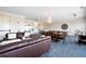 Bright living room featuring a chandelier, dining area, and an exit door at 351 Washington Ne Ave # 205, Marietta, GA 30060