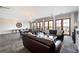 Bright living room featuring hardwood floors, chandelier, and access to a private outdoor deck at 351 Washington Ne Ave # 205, Marietta, GA 30060