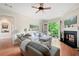 Bright living room with fireplace, balcony access, hardwood floors and comfortable seating at 351 Washington Ne Ave # 205, Marietta, GA 30060
