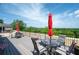 Relax on this spacious outdoor patio furnished with comfortable seating and tables with sun umbrella at 351 Washington Ne Ave # 205, Marietta, GA 30060