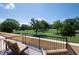 Serene outdoor balcony view of a memorial park on a clear, sunny day at 351 Washington Ne Ave # 205, Marietta, GA 30060