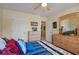 Bright bedroom with ceiling fan, colorful bedding, and dual dressers offer ample storage space at 3700 Mays Xing, Atlanta, GA 30331