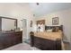 Bedroom features a vaulted ceiling, dark wood furniture, and a window for natural light at 3700 Mays Xing, Atlanta, GA 30331