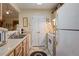Bright kitchen equipped with updated appliances, wood cabinets, and a double sink, ideal for everyday cooking at 3700 Mays Xing, Atlanta, GA 30331