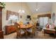 Open-concept living room with high ceilings and a dining area with a ceiling fan provides a flexible living space at 3700 Mays Xing, Atlanta, GA 30331