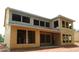 Exterior framing of a new two-story home with large windows, awaiting completion at 4835 Beechnut Circle, Cumming, GA 30028