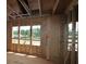 Framing stage shows a room with natural light, providing a glimpse of the future space at 4835 Beechnut Circle, Cumming, GA 30028
