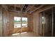 Framing stage showcases the natural light and layout of this room with large windows at 4835 Beechnut Circle, Cumming, GA 30028